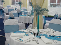 White Chair Covers and Teal Sashes